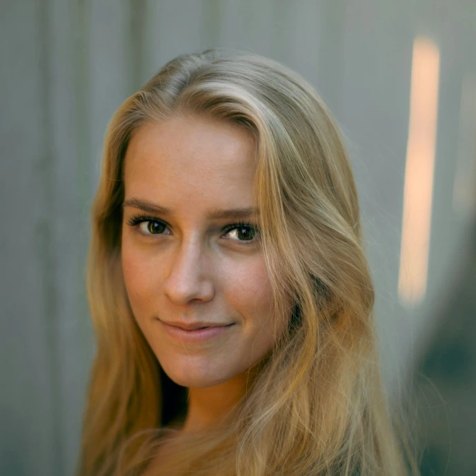 woman in black shirt smiling